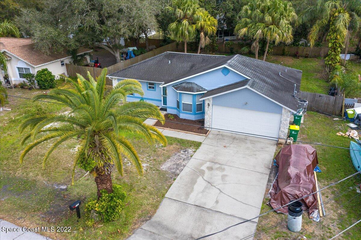 6165 Corning Road Cocoa, FL 32927 - Photo 30 of 44 an aerial view of a house with a yard basket ball court and outdoor seating