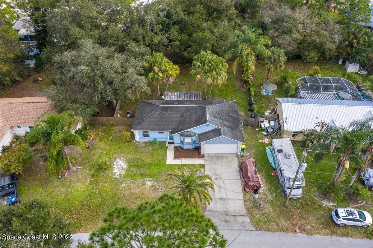 6165 Corning Road Cocoa, FL 32927 - Photo 31 of 44 an aerial view of a garden with swimming pool