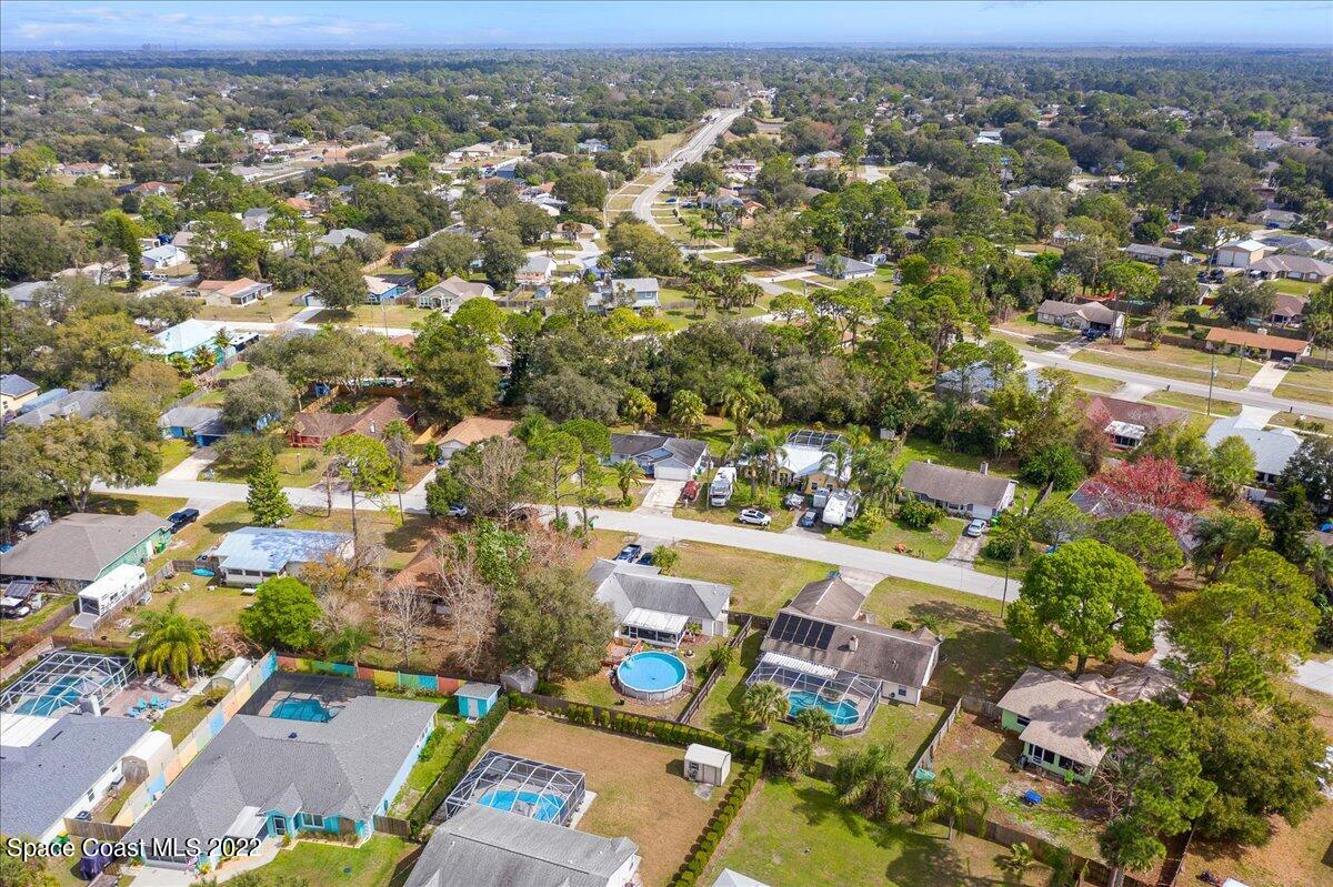 6165 Corning Road Cocoa, FL 32927 - Photo 34 of 44 an aerial view of residential houses with outdoor space