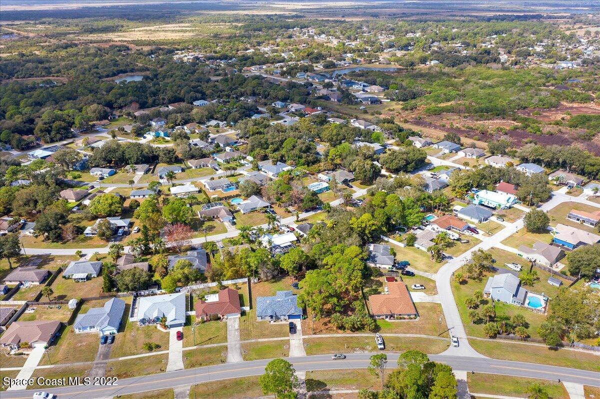 6165 Corning Road Cocoa, FL 32927 - Photo 38 of 44 an aerial view of residential houses with outdoor space
