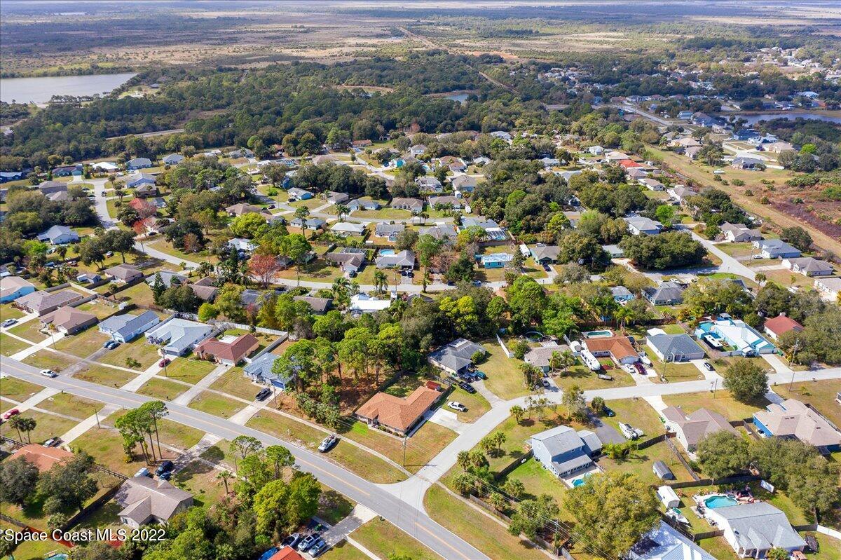 6165 Corning Road Cocoa, FL 32927 - Photo 39 of 44 an aerial view of residential houses with outdoor space