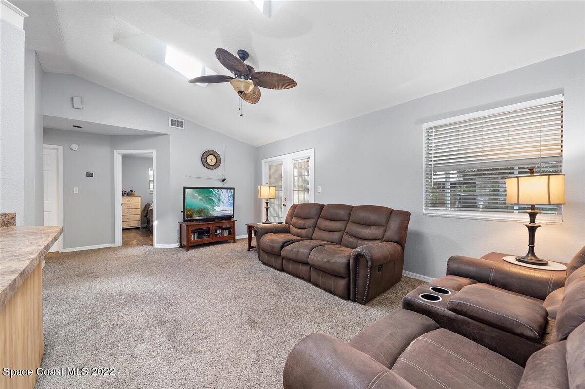 6165 Corning Road Cocoa, FL 32927 - Photo 8 of 44 a living room with furniture and a window