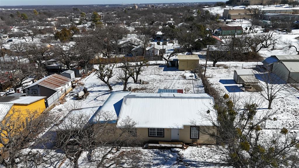 304 Neblett Street Eastland, TX 76448 - Photo 2 of 15 Snowy aerial view featuring a residential view