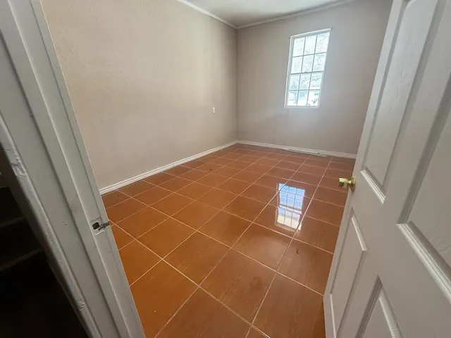a bathroom with a toilet and a bathtub