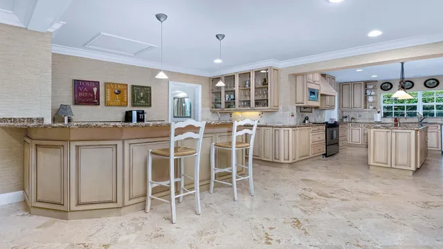 a kitchen with stainless steel appliances granite countertop a sink and cabinets