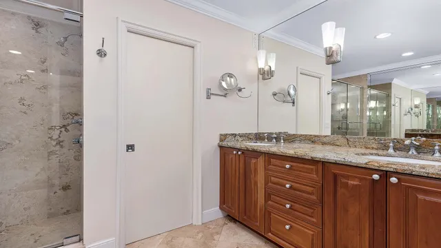 a spacious bedroom with a bed and a large window