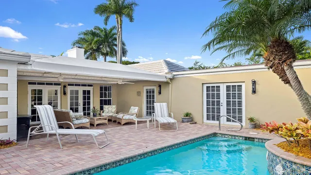 a view of a balcony with an outdoor space and seating area
