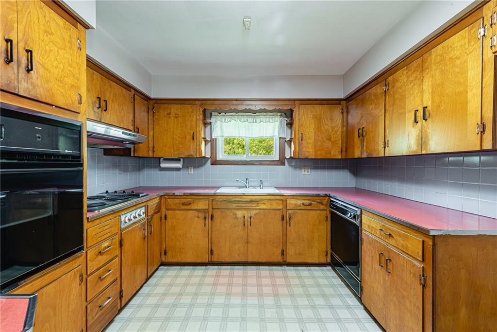 520 North 9th Street Indiana, PA 15701 - Photo 15 of 29 a kitchen with stainless steel appliances granite countertop a sink and cabinets