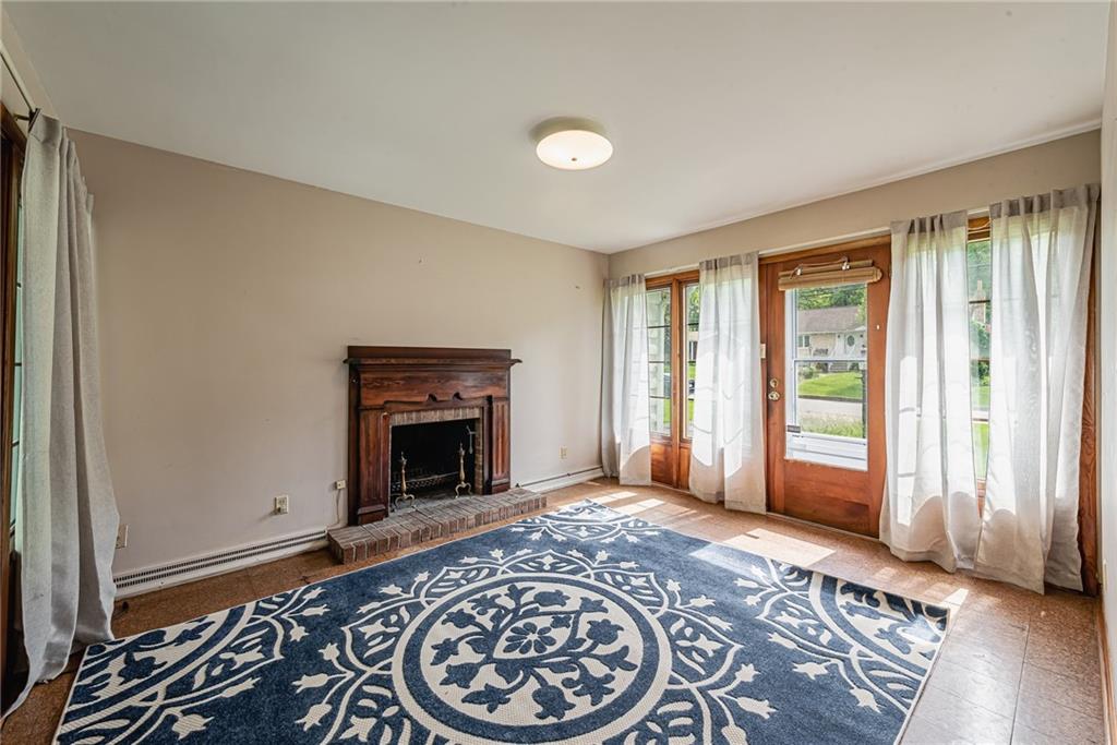 520 North 9th Street Indiana, PA 15701 - Photo 16 of 29 a living room with a fireplace and a rug