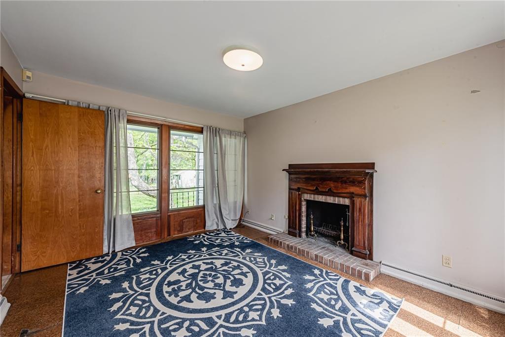 520 North 9th Street Indiana, PA 15701 - Photo 17 of 29 a view of a livingroom with a fireplace and wooden floor