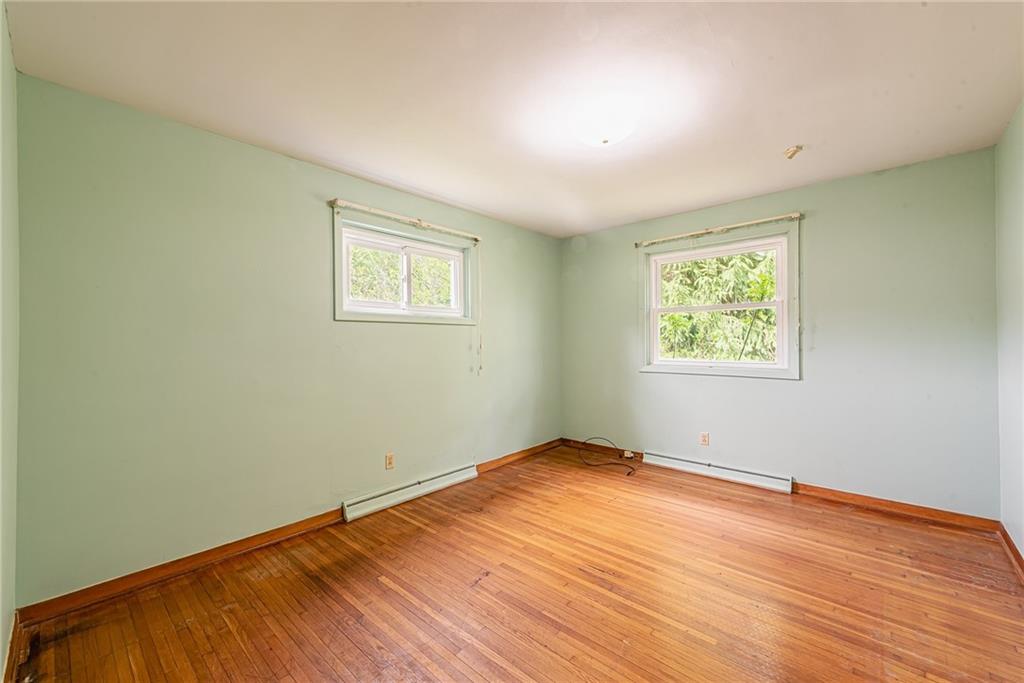 520 North 9th Street Indiana, PA 15701 - Photo 22 of 29 a view of an empty room with wooden floor and a window