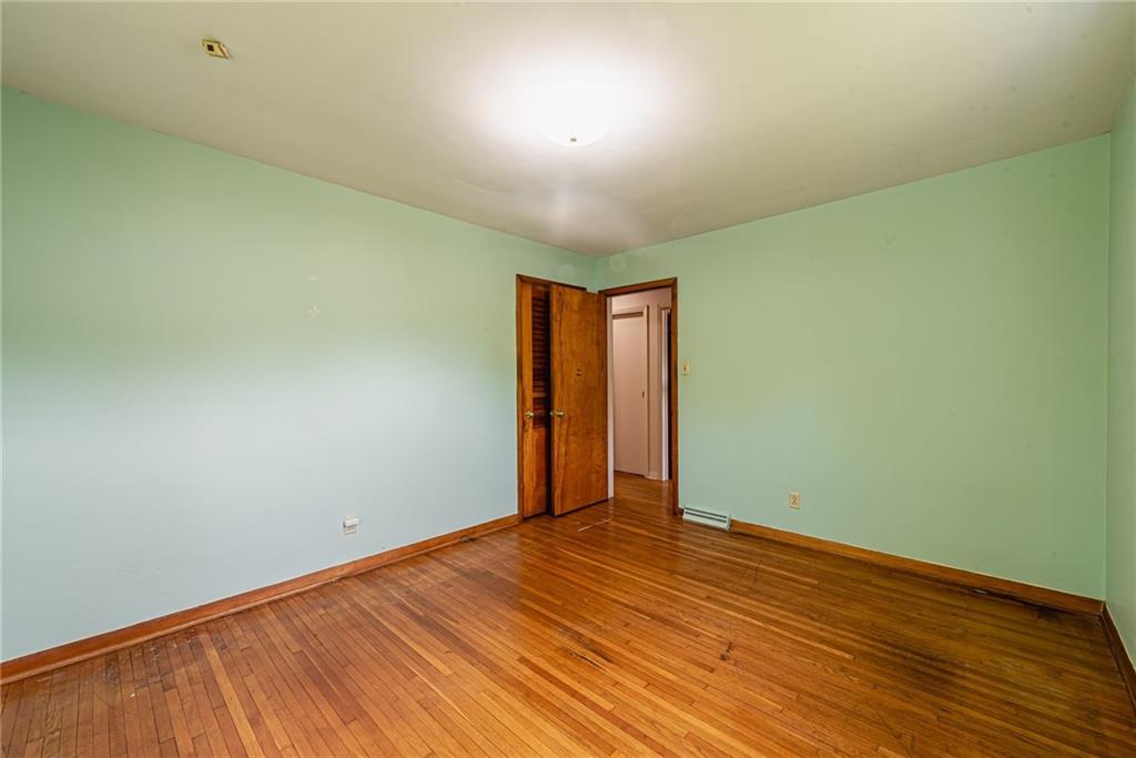 520 North 9th Street Indiana, PA 15701 - Photo 23 of 29 an empty room with wooden floor and windows