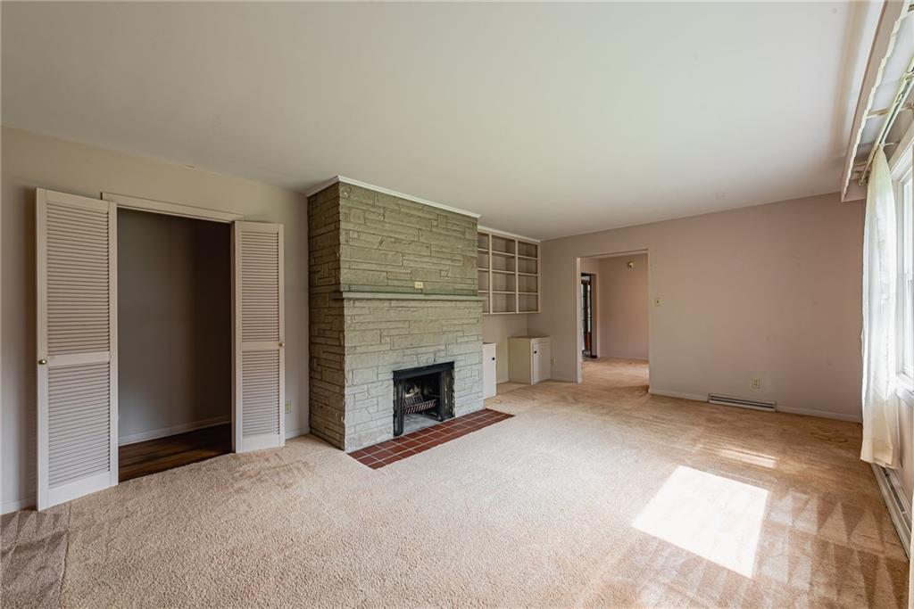 520 North 9th Street Indiana, PA 15701 - Photo 8 of 29 an empty room with fireplace and windows