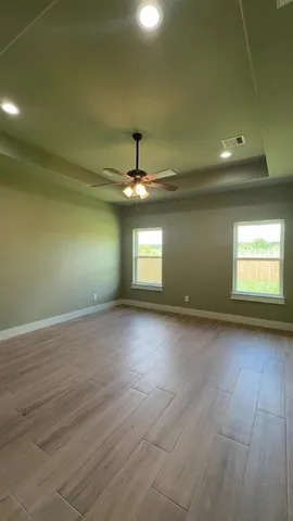 an empty room with a empty space and a window