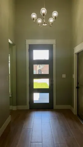 a view of a livingroom with a bathroom and a bathtub