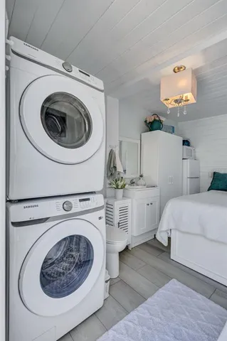 a bathroom with a granite countertop a sink and a mirror