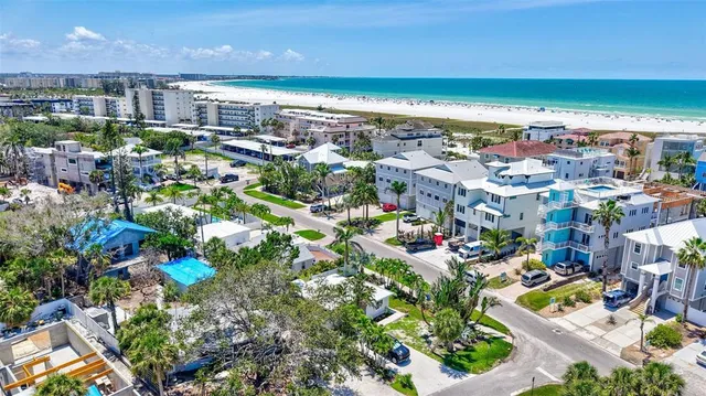 an aerial view of a house with a yard and a garden