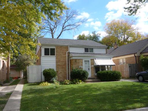 711 Long Road Glenview, IL 60025 - Photo 1 of 9 a front view of a house with a garden
