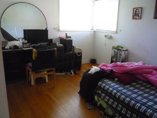 711 Long Road Glenview, IL 60025 - Photo 4 of 9 a bedroom with a bed and a flat screen tv