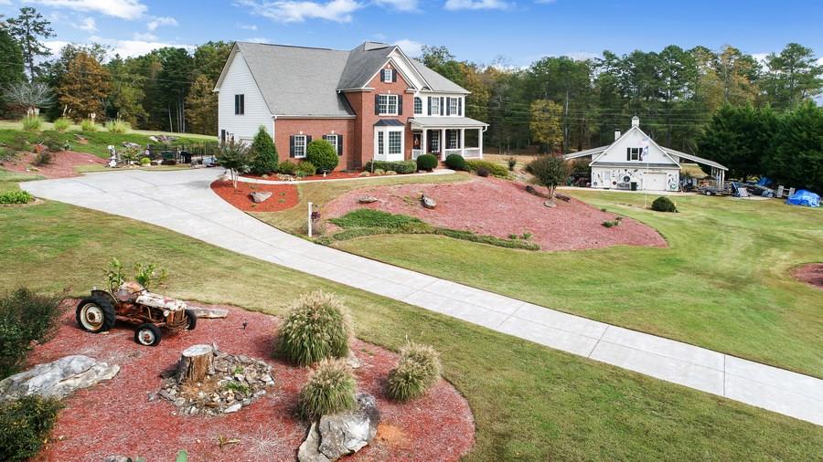 Pristinely-manicured property situated on 2 private acres! This is one of those hard-to-find properties that offers not just the acreage, but it has a pool and a 60x32 two story workshop!