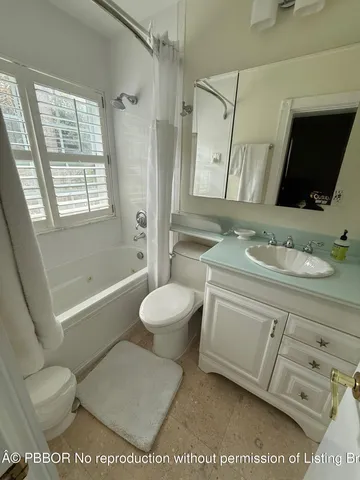 a bathroom with a toilet a sink and a bathtub