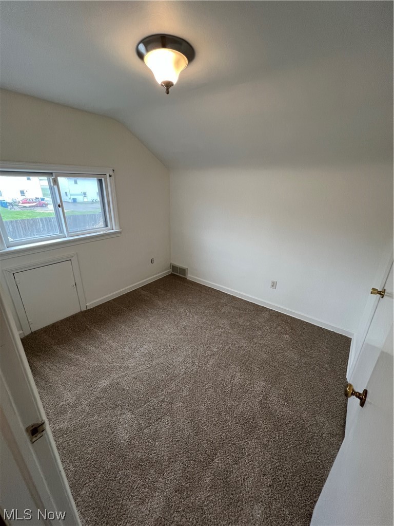 545 7th Street Struthers, OH 44471 - Photo 13 of 17 Carpeted empty room with lofted ceiling