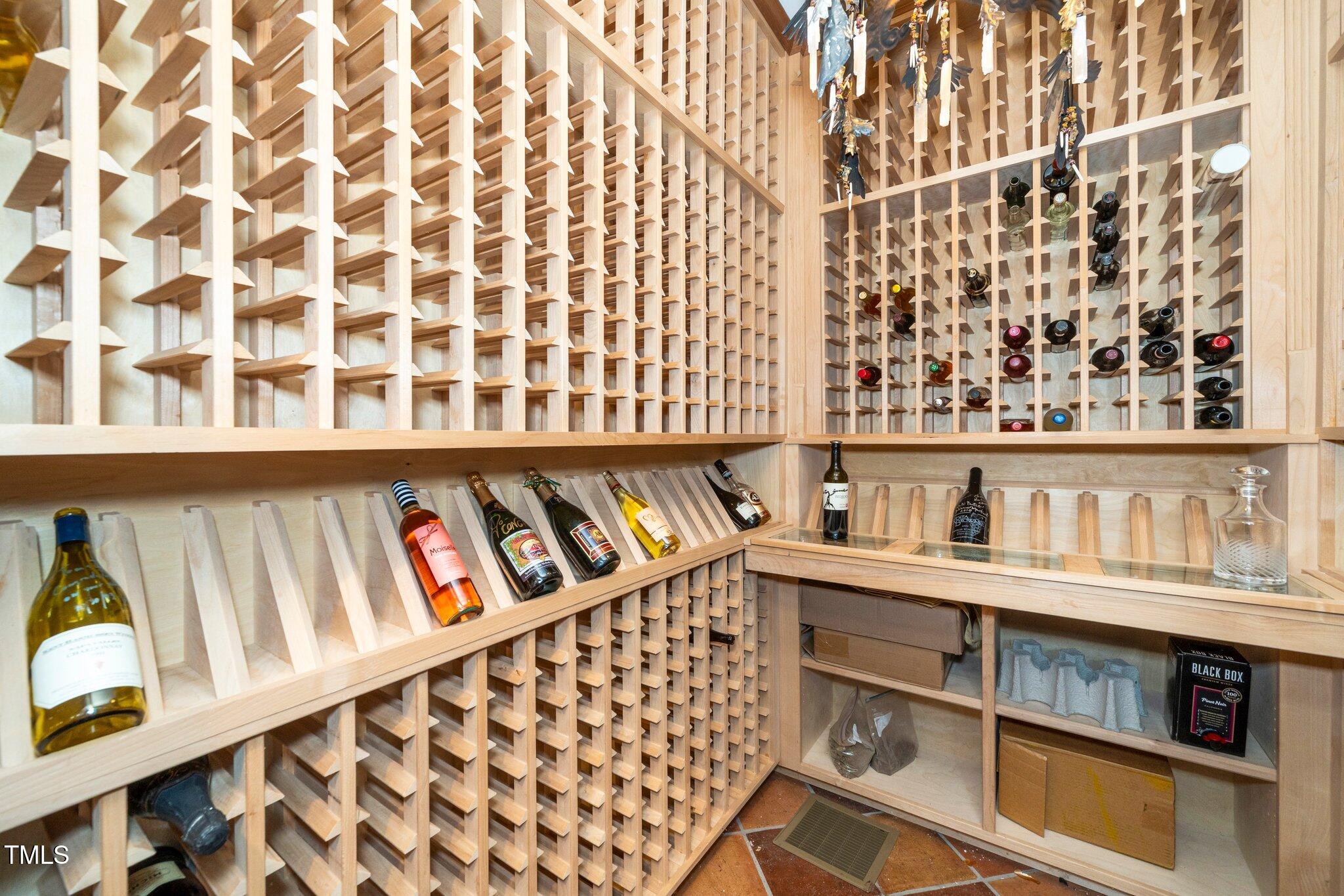 1712 Briarforest Place Raleigh, NC 27615 - Photo 17 of 55 The wine cellar can hold several sizes of bottles and over 1000 bottles of your favorite wine.