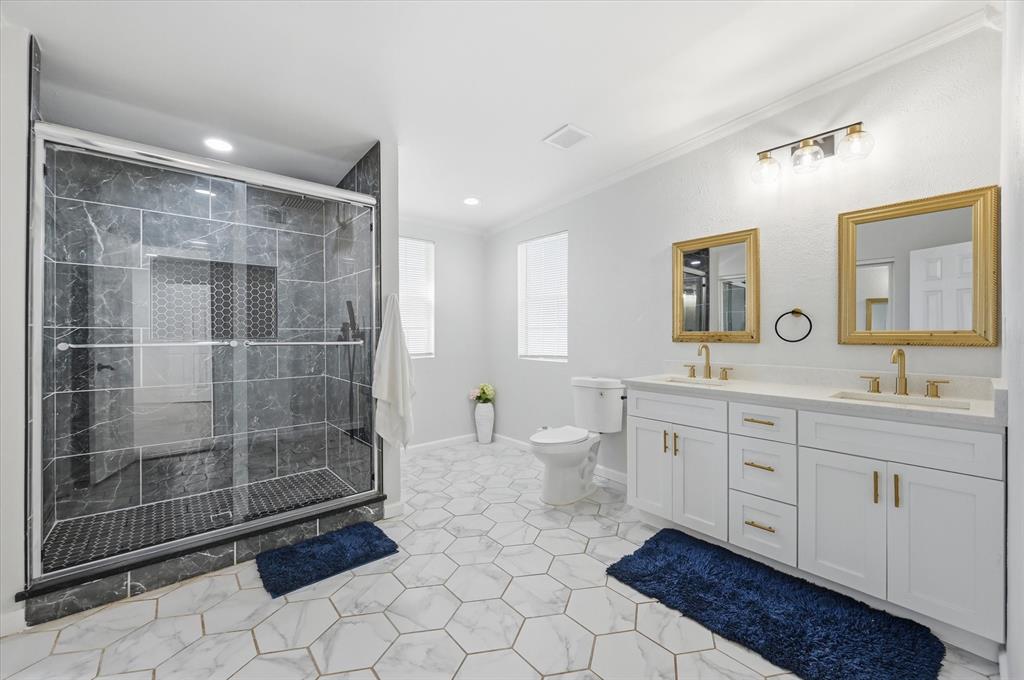 330 West Vinyard Road Duncanville, TX 75137 - Photo 11 of 20 a spacious bathroom with a mirror a shower and a sink