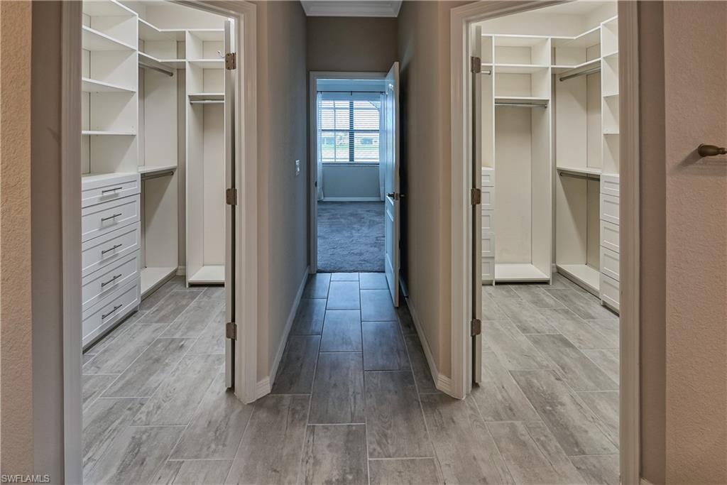 19576 The Pl Boulevard Estero, FL 33928 - Photo 12 of 35 a view of a hallway with wooden floor and closet