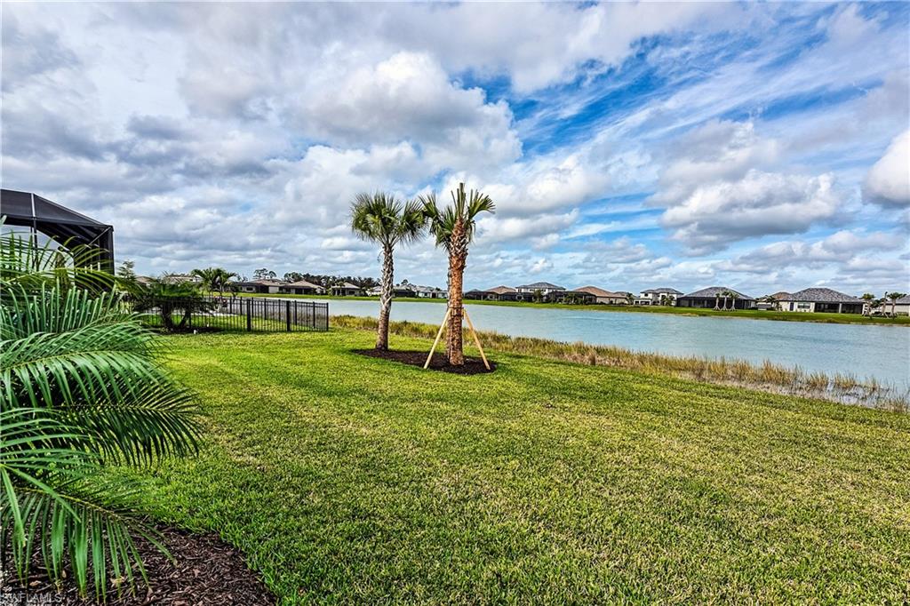 19576 The Pl Boulevard Estero, FL 33928 - Photo 23 of 35 a view of a lake with a big yard