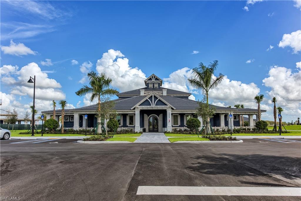 19576 The Pl Boulevard Estero, FL 33928 - Photo 24 of 35 a front view of building with garden