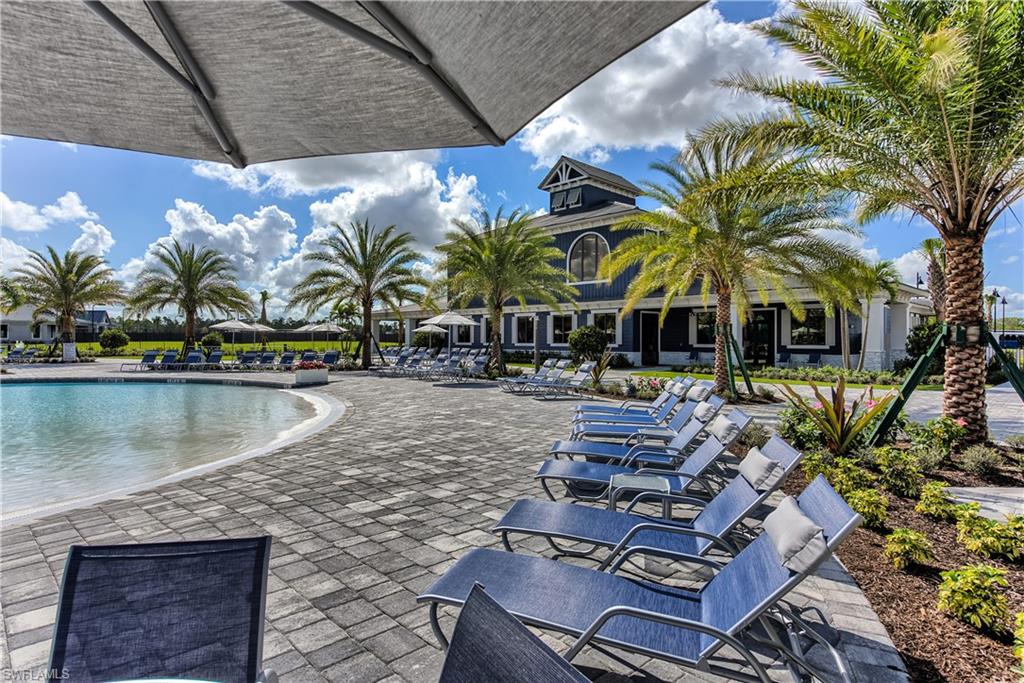 19576 The Pl Boulevard Estero, FL 33928 - Photo 27 of 35 a view of swimming pool with outdoor seating and a yard