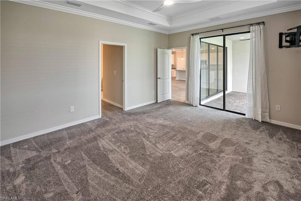 19576 The Pl Boulevard Estero, FL 33928 - Photo 9 of 35 an empty room with windows and closet