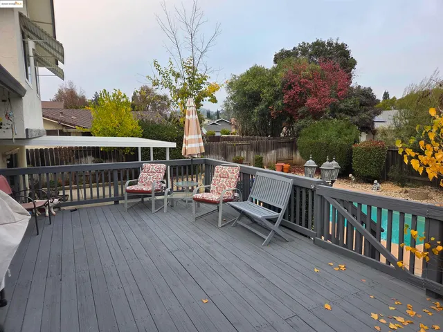 a view of a chairs on wooden deck