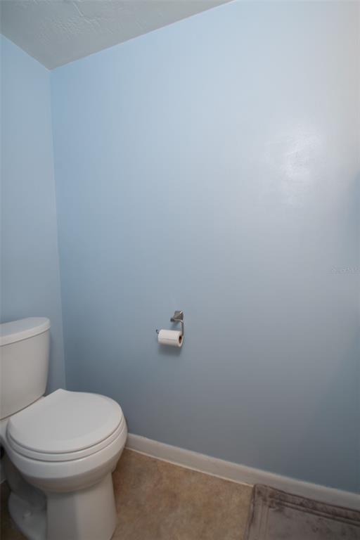 2300 Southwest 43rd Street, Unit K5 Gainesville, FL 32607 - Photo 14 of 18 a white toilet sitting next to a white wall