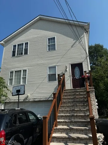 a front view of house along with street