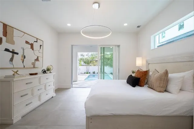 a bedroom with a bed and window