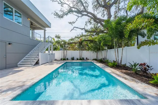 a view of a hallway view with wooden floor and entryway