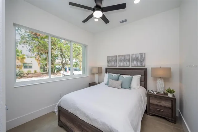 a large white bed in a white room