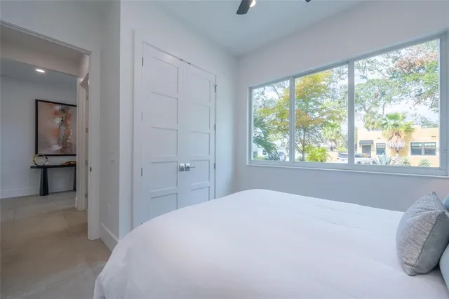 a bathroom with a sink toilet vanity and shower