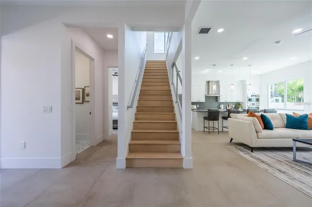 a view of a patio with table and chairs with wooden floor and fence