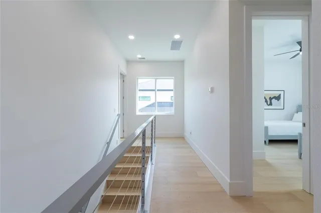a view of a patio with table and chairs and potted plants
