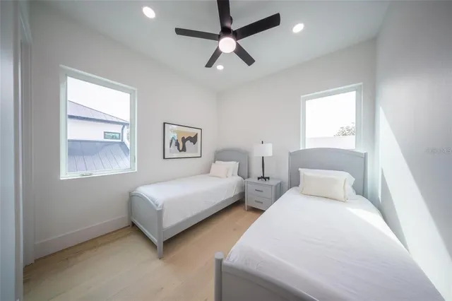 a view of a patio with table and chairs potted plants with wooden floor