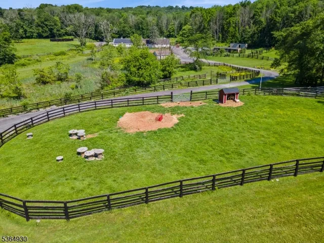 a view of a swimming pool with a yard