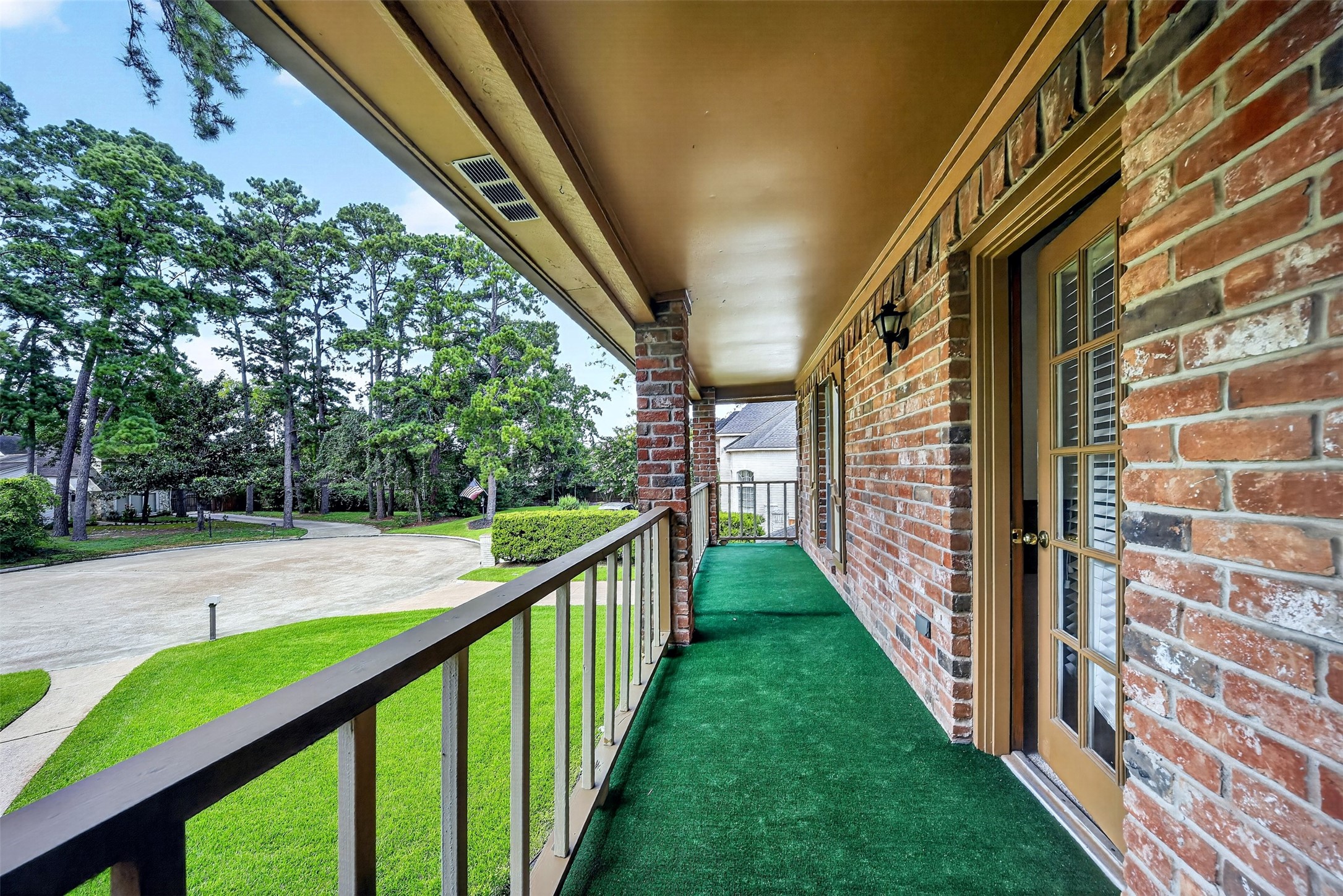 6507 Spring Leaf Drive Spring, TX 77379 - Photo 26 of 50 Enjoy the elevated balcony overlooking the beautifully landscaped front yard and quiet tree lined street-perfect for relaxing with your morning coffee!