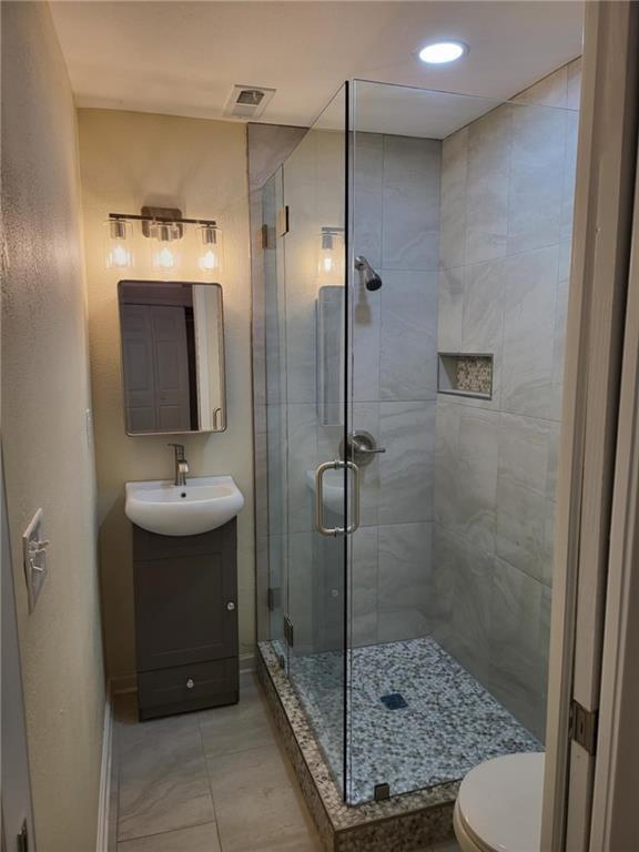 887 Bridgewater Street Southwest, Unit A Atlanta, GA 30310 - Photo 18 of 21 a bathroom with a shower sink mirror and toilet