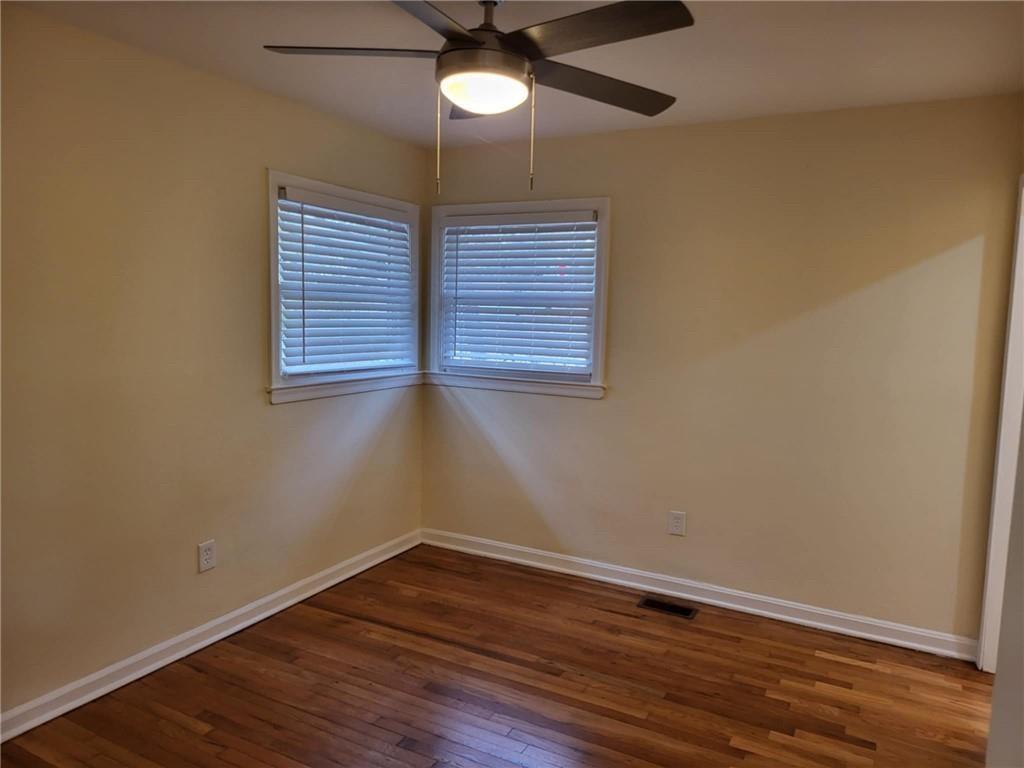 887 Bridgewater Street Southwest, Unit A Atlanta, GA 30310 - Photo 3 of 21 a view of an empty room with wooden floor and a window