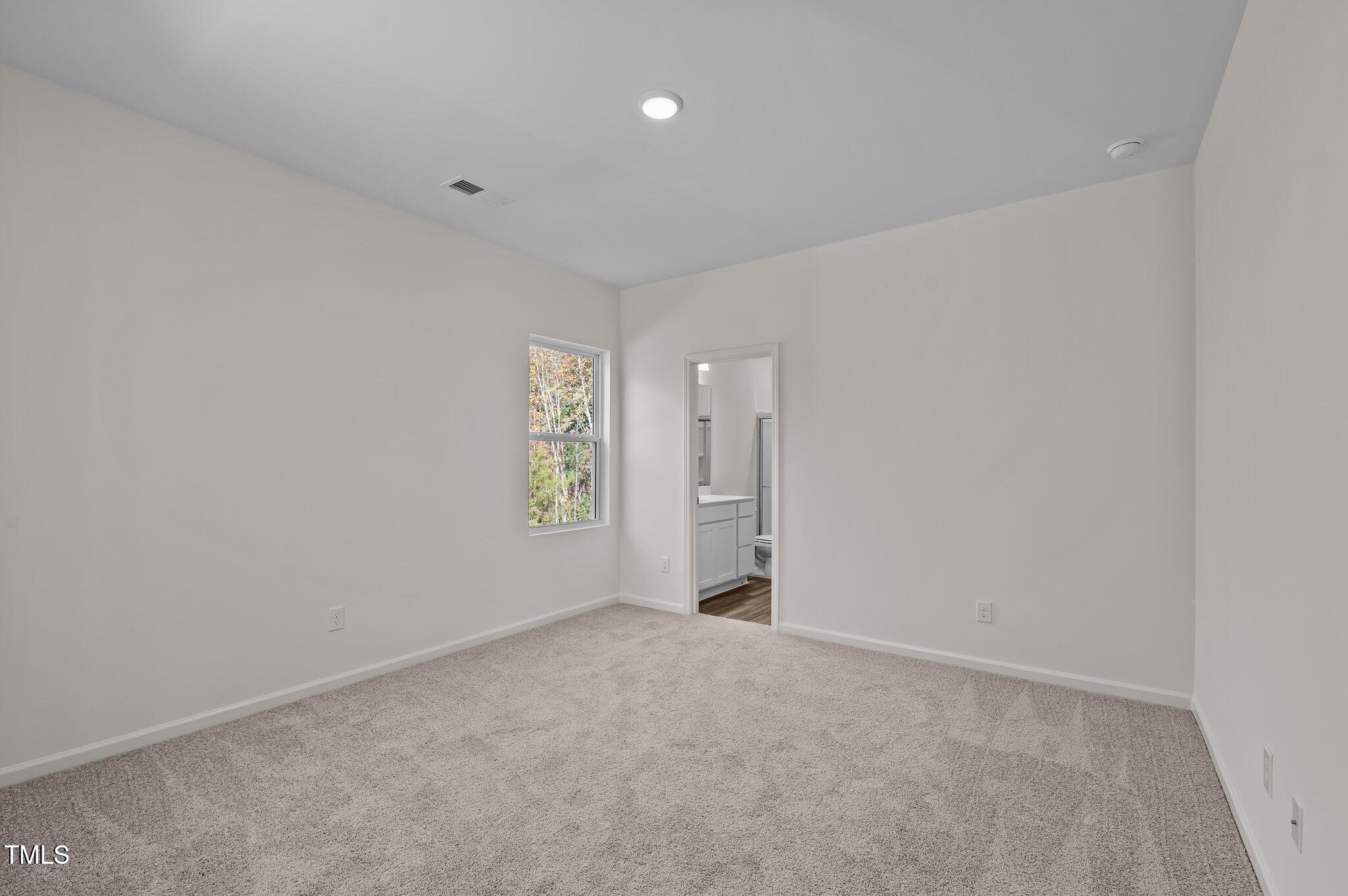 955 Embraer Way Spring Hope, NC 27882 - Photo 15 of 25 a view of an empty room with a window