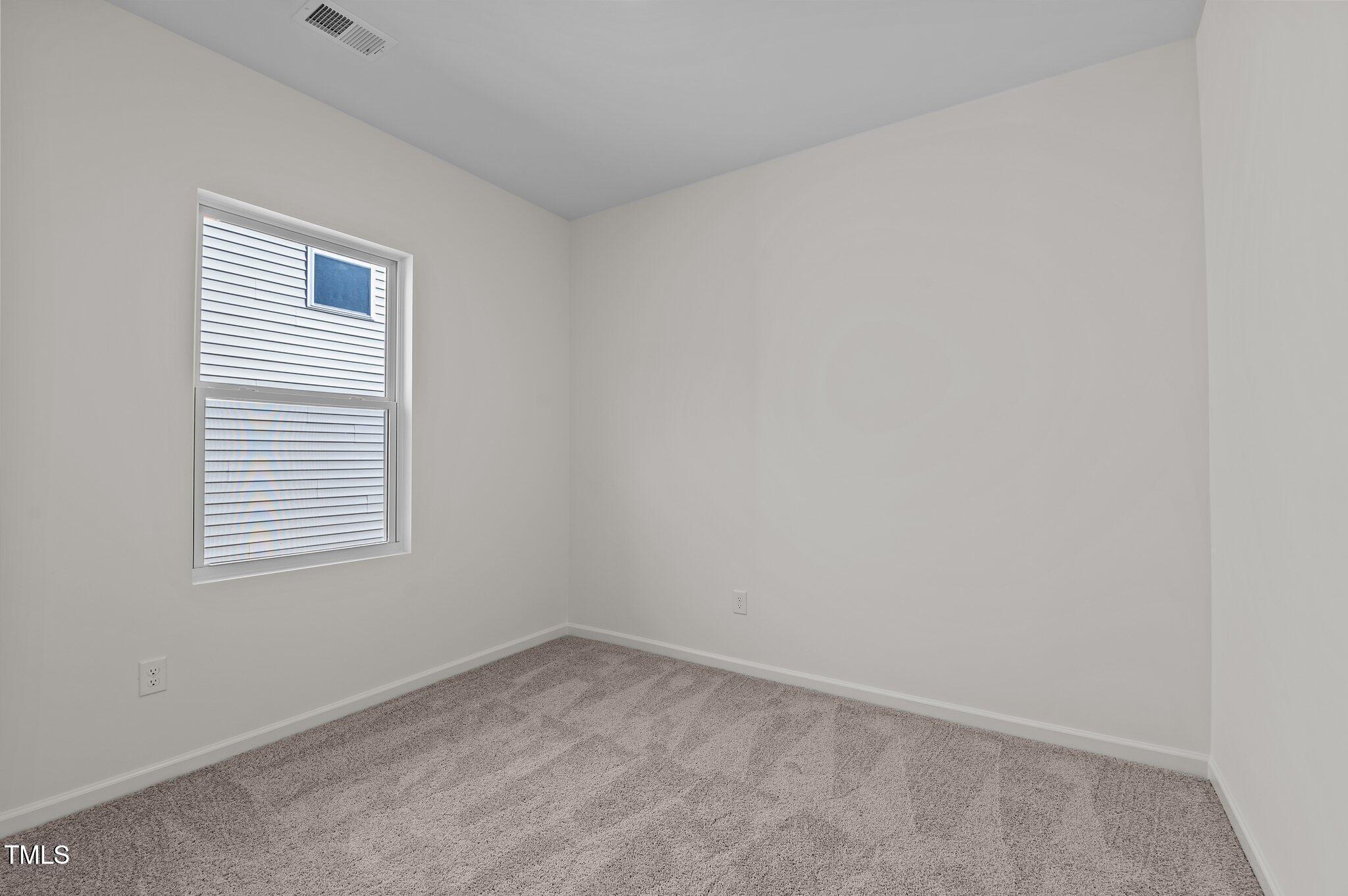 955 Embraer Way Spring Hope, NC 27882 - Photo 21 of 25 an empty room with a window