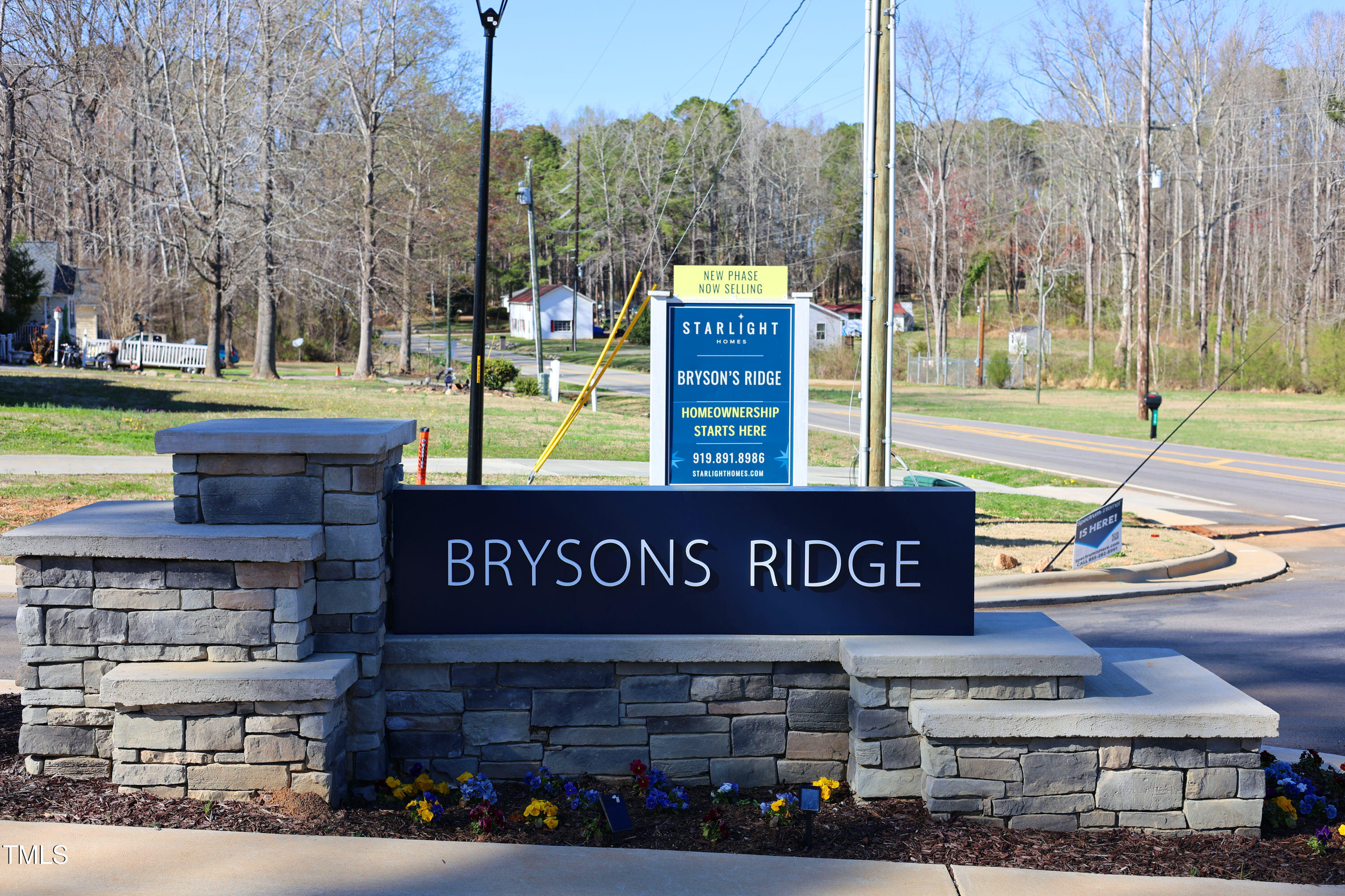 955 Embraer Way Spring Hope, NC 27882 - Photo 25 of 25 a view of a street with a building and trees